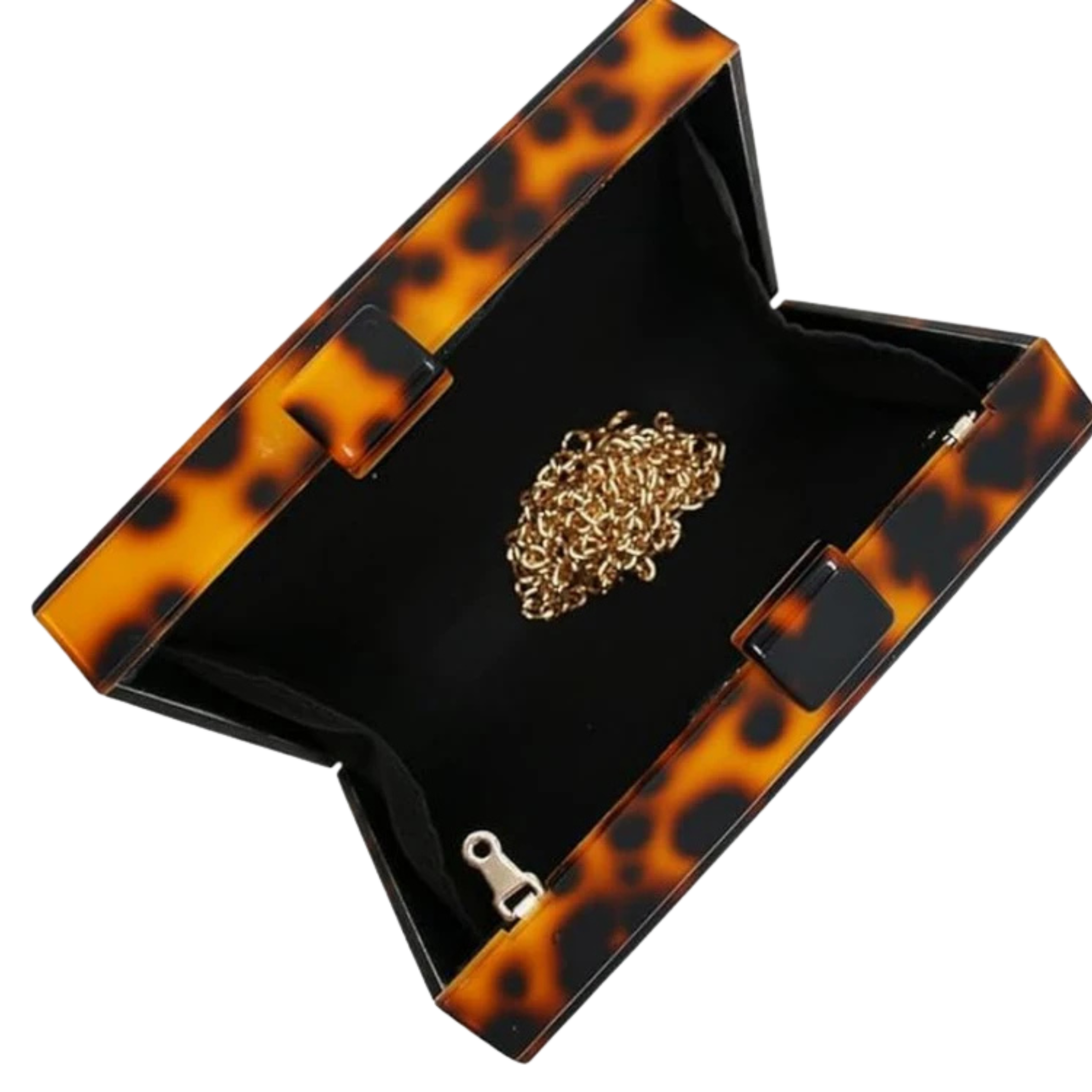 An open tortoiseshell clutch-style jewelry box with a black velvet interior, holding a gold chain necklace on a light gray background.