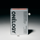 Onélogy multivitamin packaging with two tablets on a gradient background