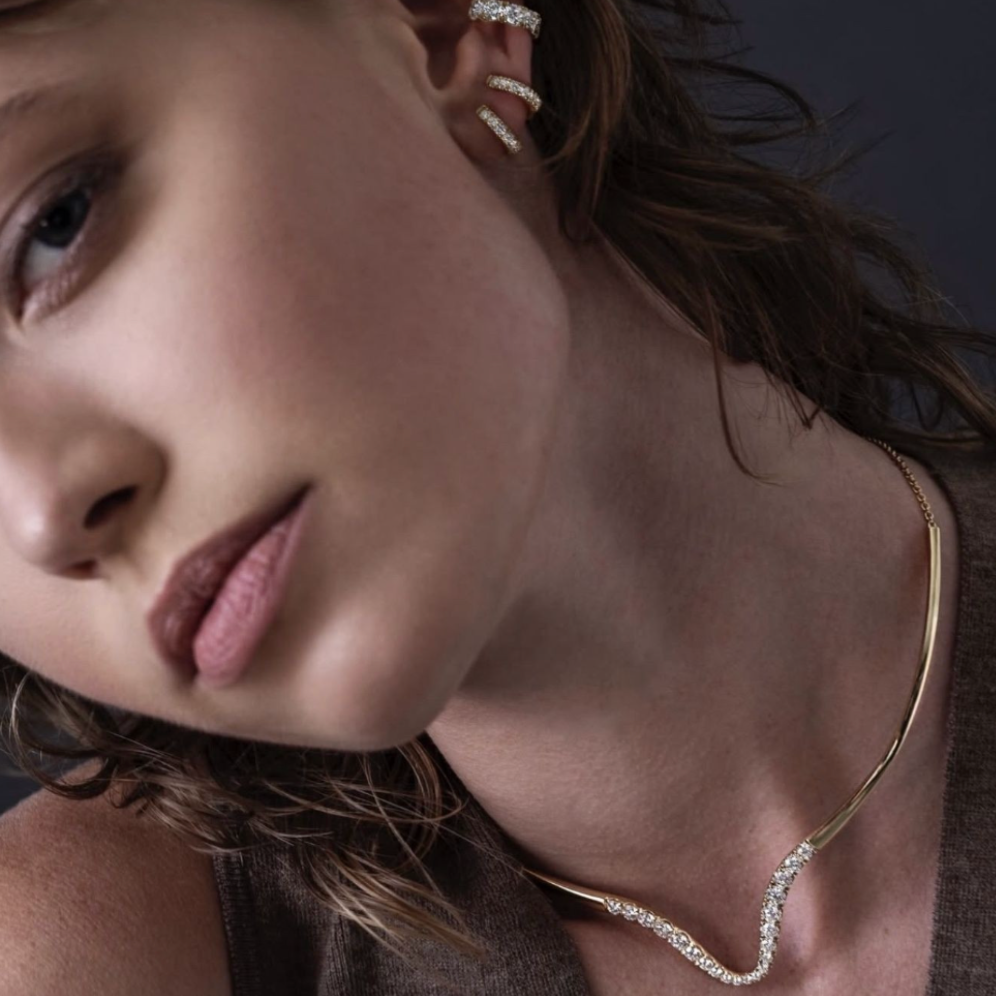 Woman wearing The Vault Necklace and Earrings