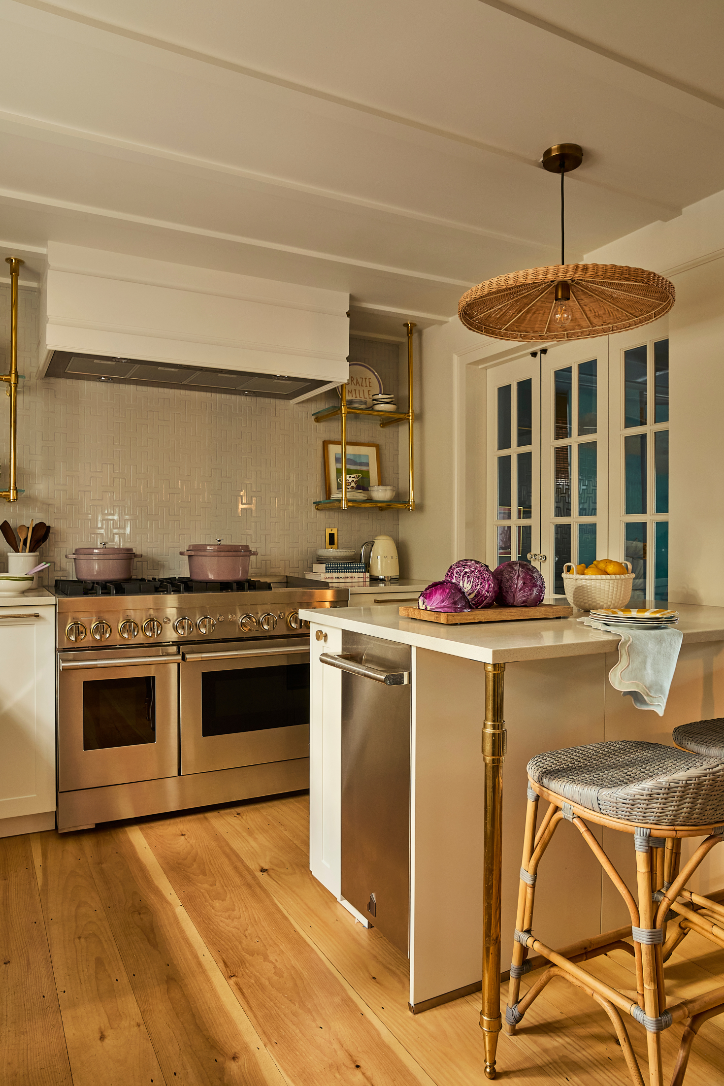 Modern kitchen with stainless steel appliances and wooden floor